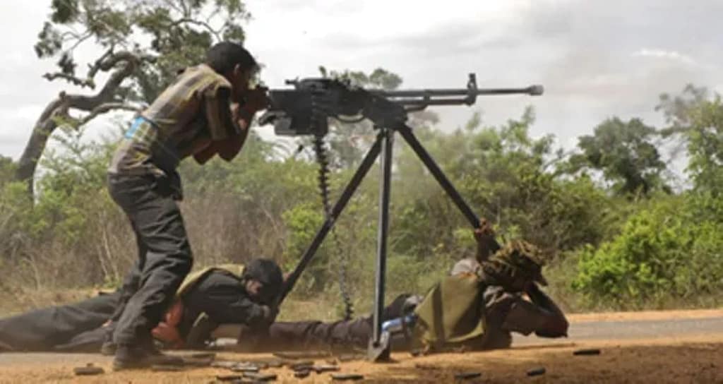 Tamil Tigers firing a DShK (12.7 mm) heavy machine gun