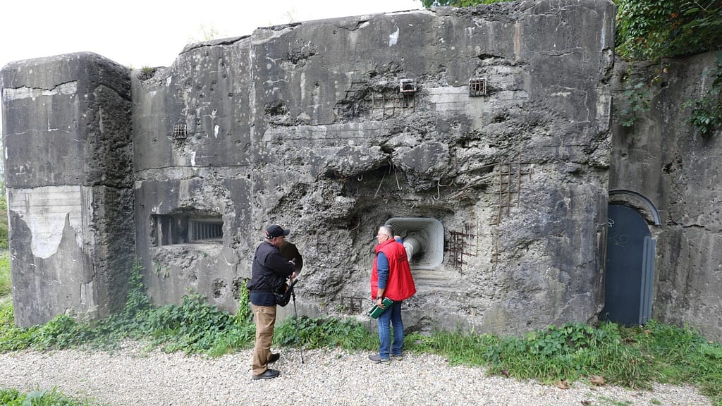 Inspecting the damage inflicted by shaped charges at Fortess Eben Emael, Belgium