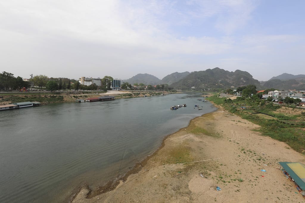 Tuyen Quang - view along the Clear River from the bridge. The bridge did not exist in 1885.