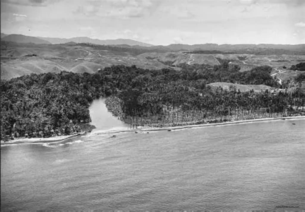 The mouth of the Matanikau as it was in 1942. The only settlement in the area was the small village of Matanikau on the western or right side of this picture. The black dots across the mouth are General Sumiyoshi's tanks, destroyed during their assault across the sandbar on 23 October 1942.