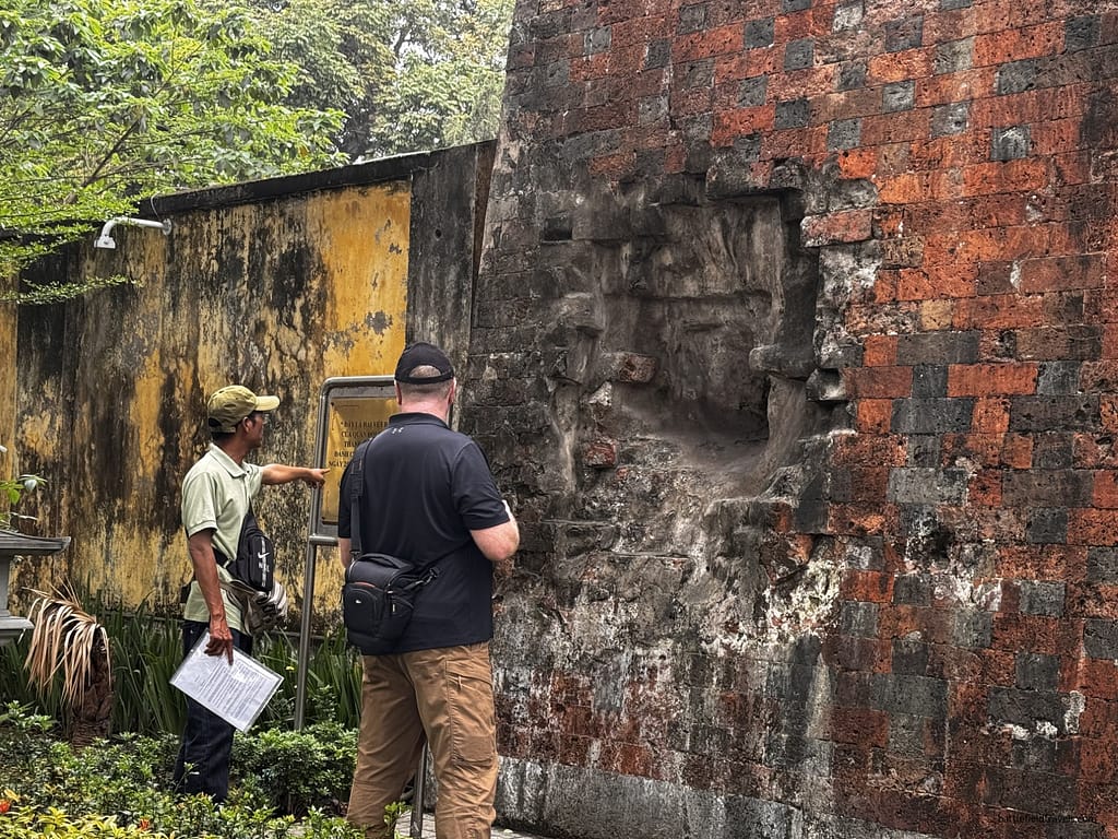 Hanoi Citadel. Inspecting one of the impacts from Henri Riviere's 1882 naval bombardment.
