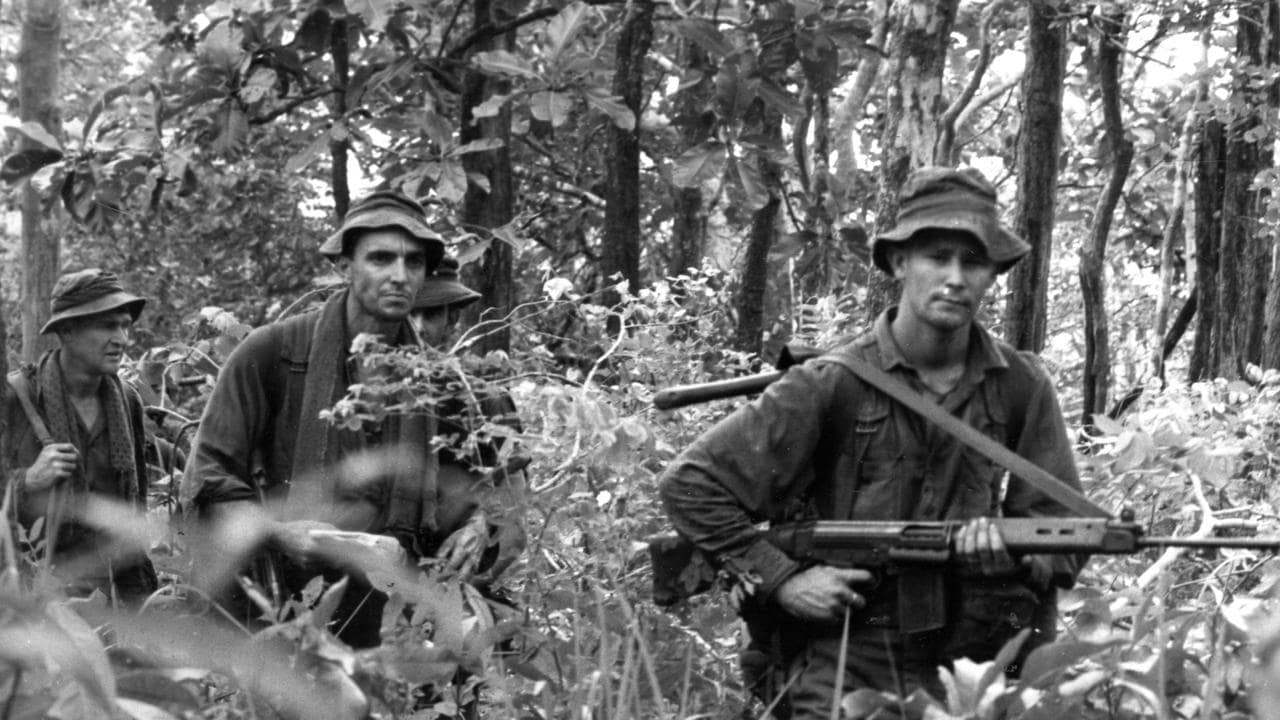 Australian soldier in Vietnam carrying a Lithgow-manufactured SLR (Self-loading Rifle), a licensed version of the FN FAL