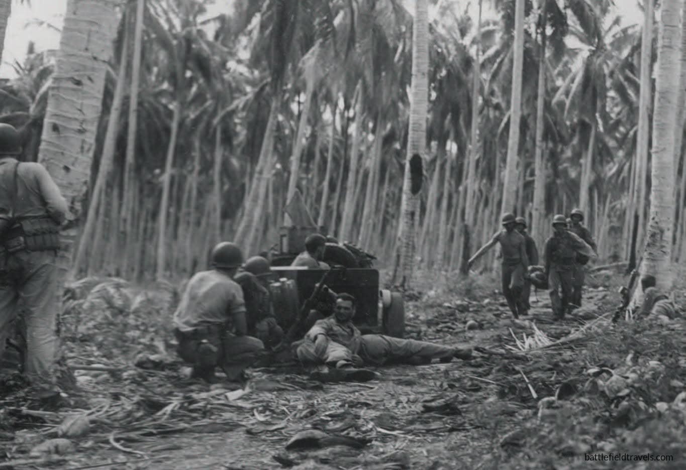 6th Marines evacuate a wounded man under fire, late Jan 1943 near the Poha River.