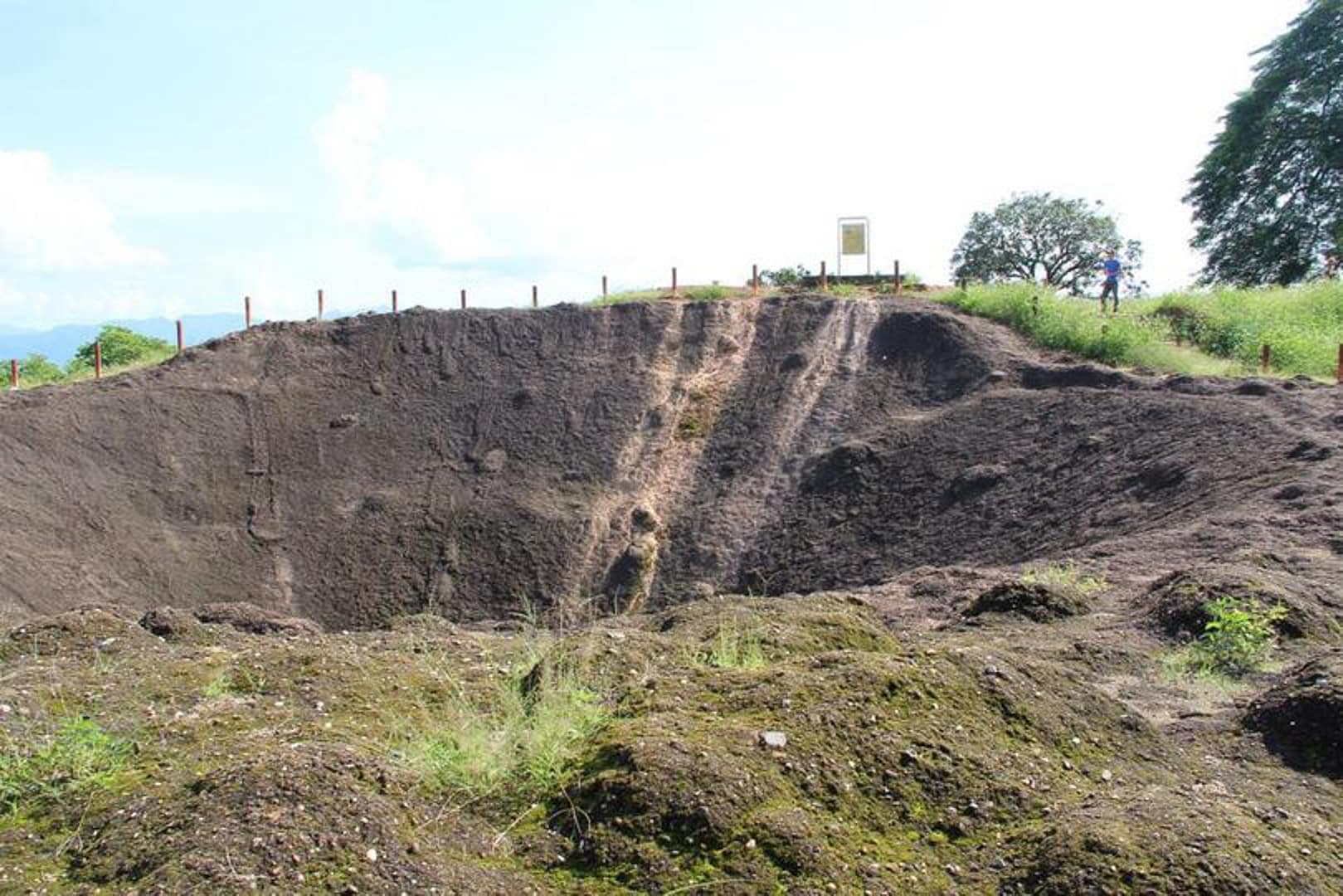 Strongpoint Eliane 2. After the initial assault on Eliane, the Viet Minh occupied half of the hill for 38 days, during which they dug under the French bunkers and detonated an enormous mine - this is the crater it left, 61 years later.