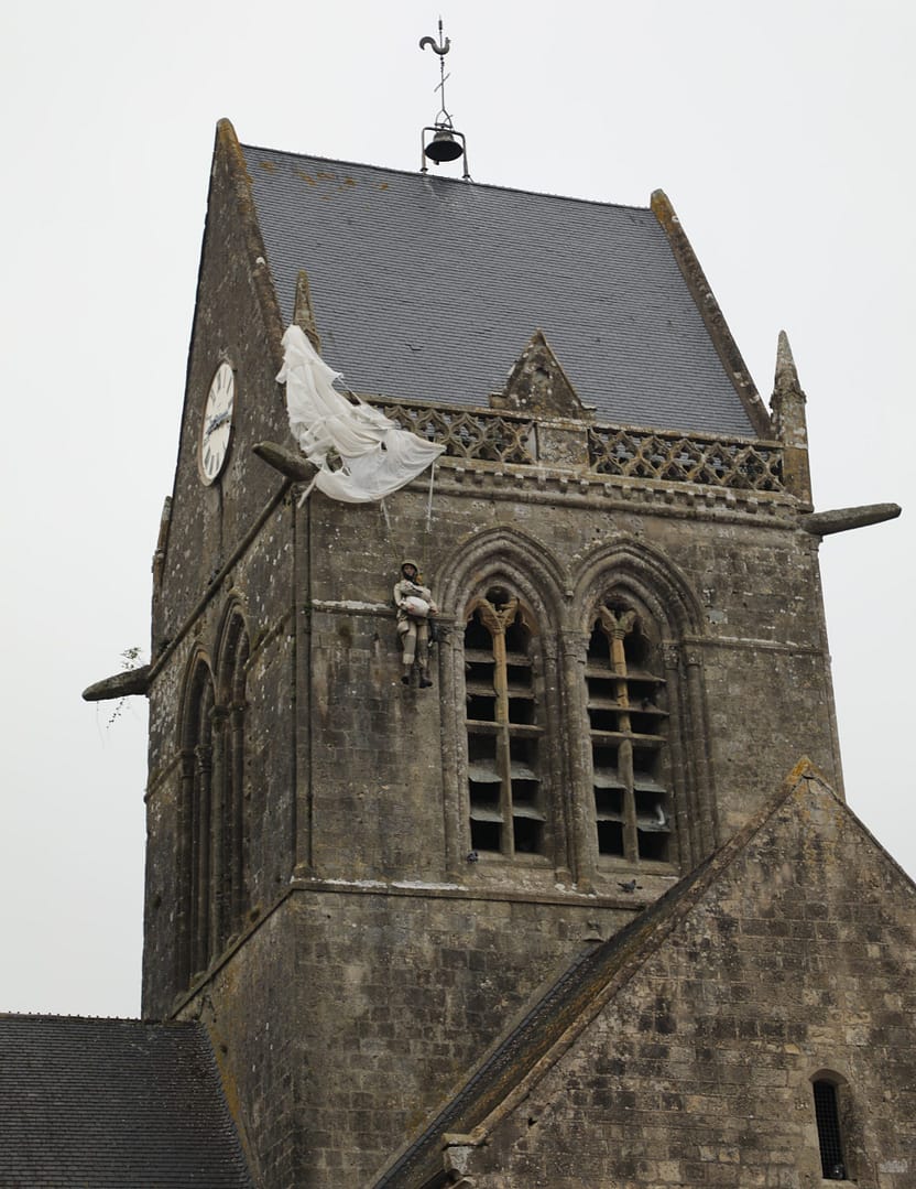 Sainte-Mere Eglise cathedral. Paratroopers from the 505th Parachute Infantry Regiment, 82nd Airborne Division, landed all over this area. Private John Steele landed on the roof of the cathedral and his parachute caught in the eaves.