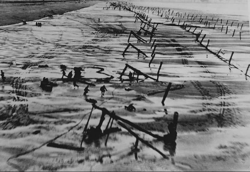 Typical beach obstacle layout on the Normandy beaches: a combination of log ramps, Czech hedgehogs, Belgian gates, pyramids, Teller mines, and various types of barbed wire. All designed to hold an enemy force in teh killing zone for as long as possible.
