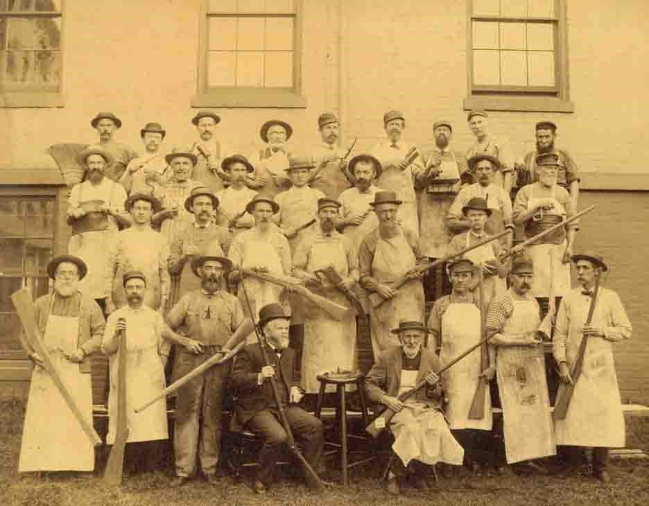 September 1886 image of the Springfield Armory stocking team. Each holds the gauges and a sample stock from the production stage he was responsible for, from rough blank to finished product. National Park Service site
