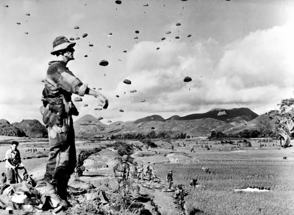 Lieutenant Rivier, chief medical officer of the 6th Colonial Parachute Battalion, watches the drop near Kỳ Lừa, Lạng Sơn, 17 July 1953